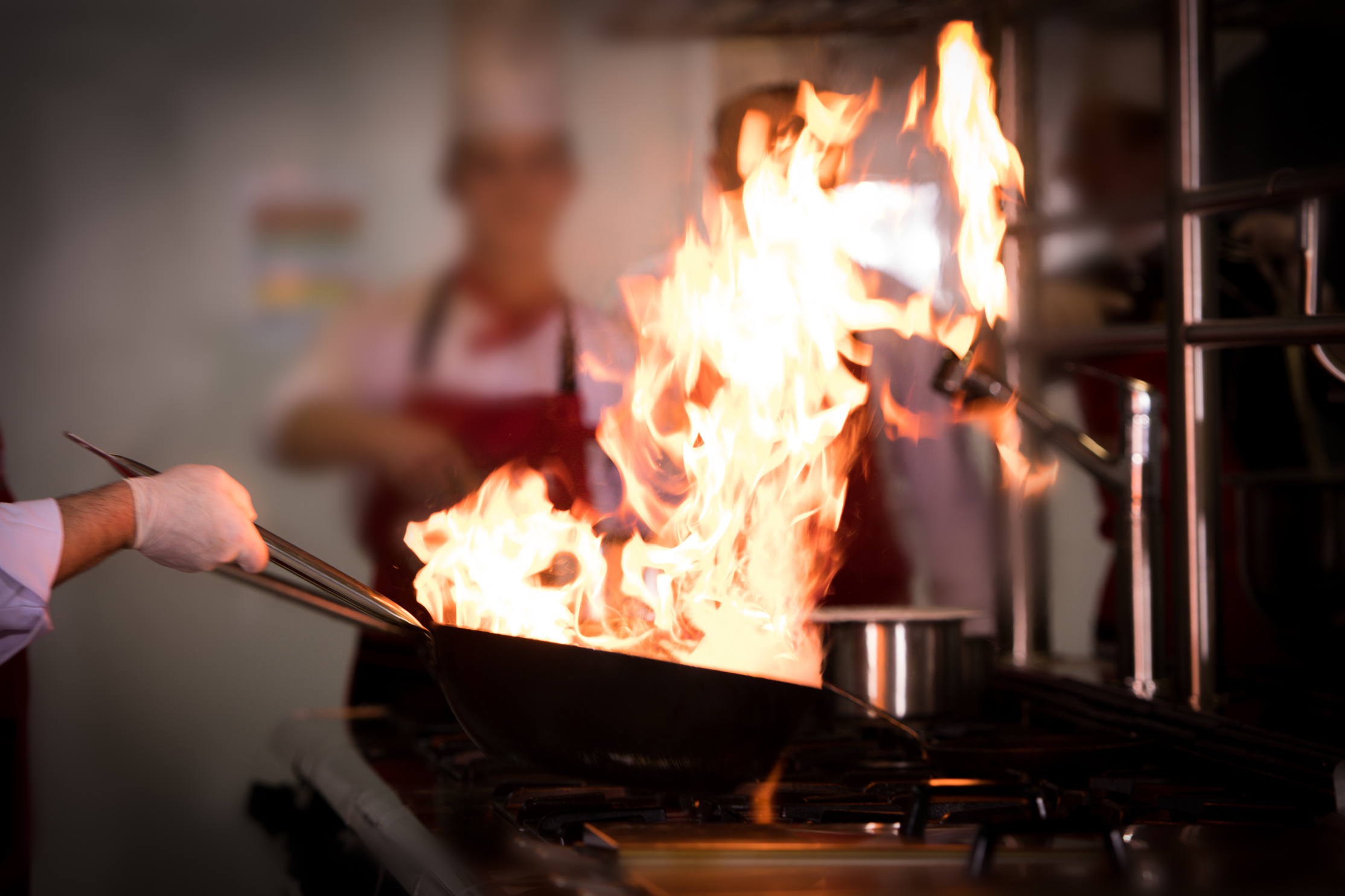 Chefs cooking in commercial kitchen